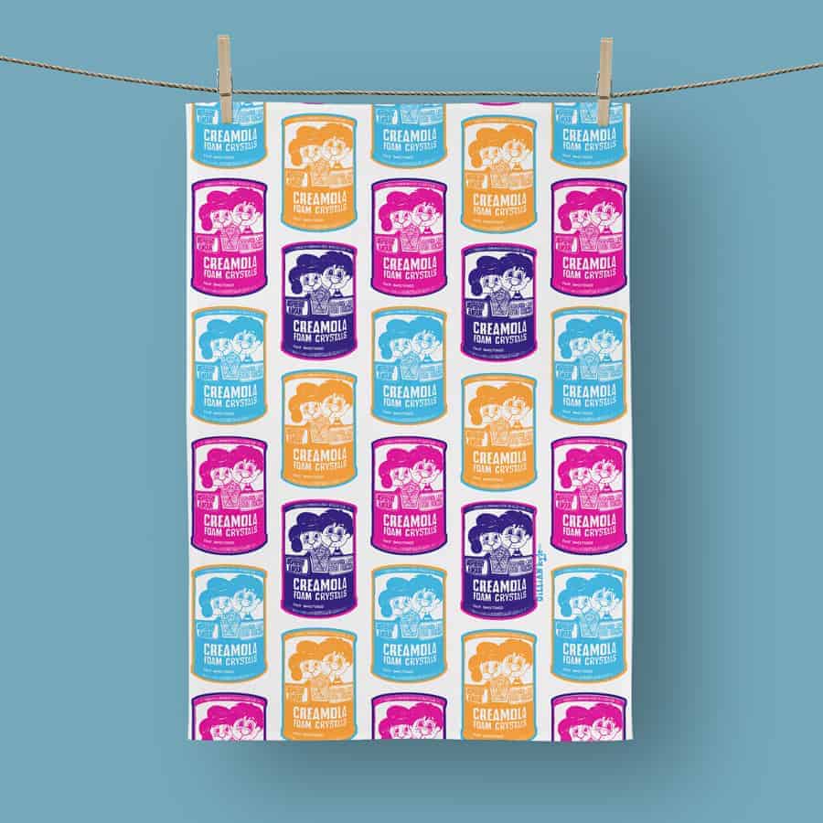 Bright Creamola Foam tea towel.