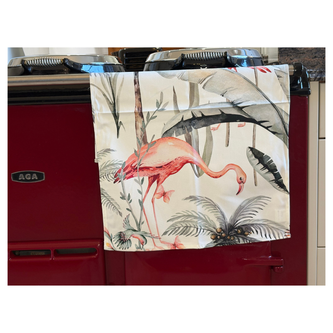 White Tropical Flamingo Tea Towel On Claret Red AGA Close Up View.  Quirky Gift For Home Lovers.