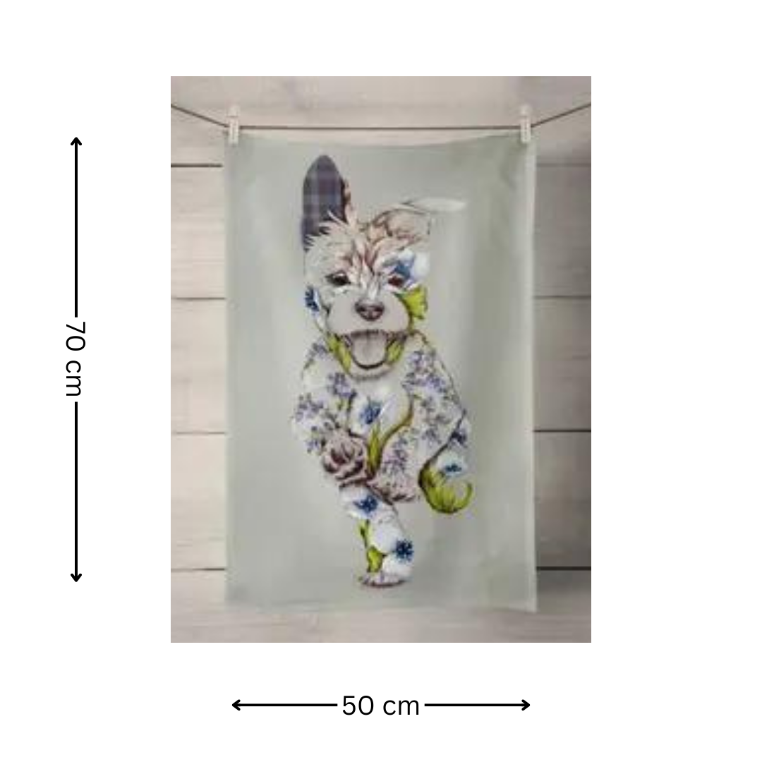 100% Cotton Sage Green Dog Tea Towel featuring patchwork dog on sage green tea towel, hanging on washing line with wooden background on white background with text which has two black arrows and states that the measurements are 70 cm x 50 cm