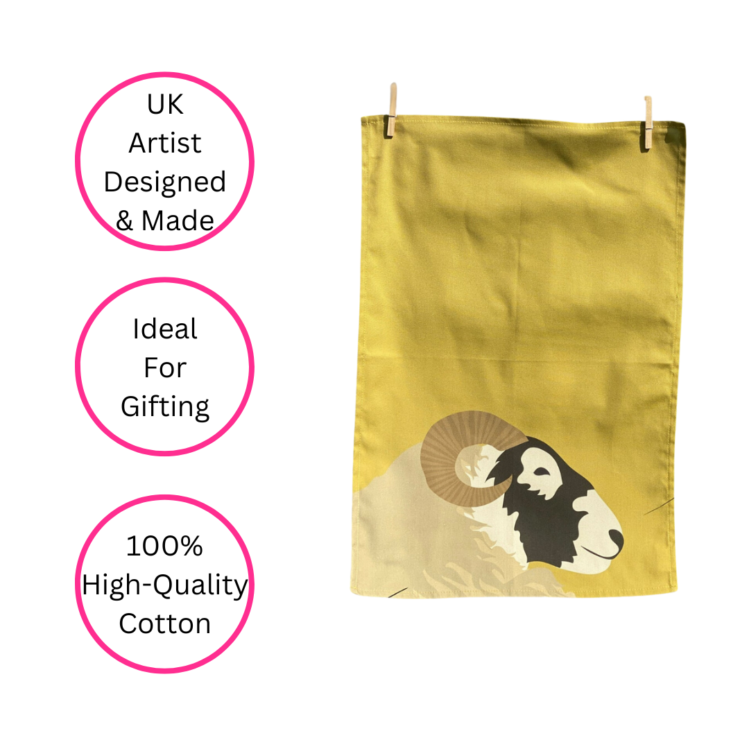 Blackface Sheep Tea Towel hanging by pegs on white background with three pink discs highlighting the benefits - UK artist designed and made, ideal for gifting and 100% high-quality cotton.