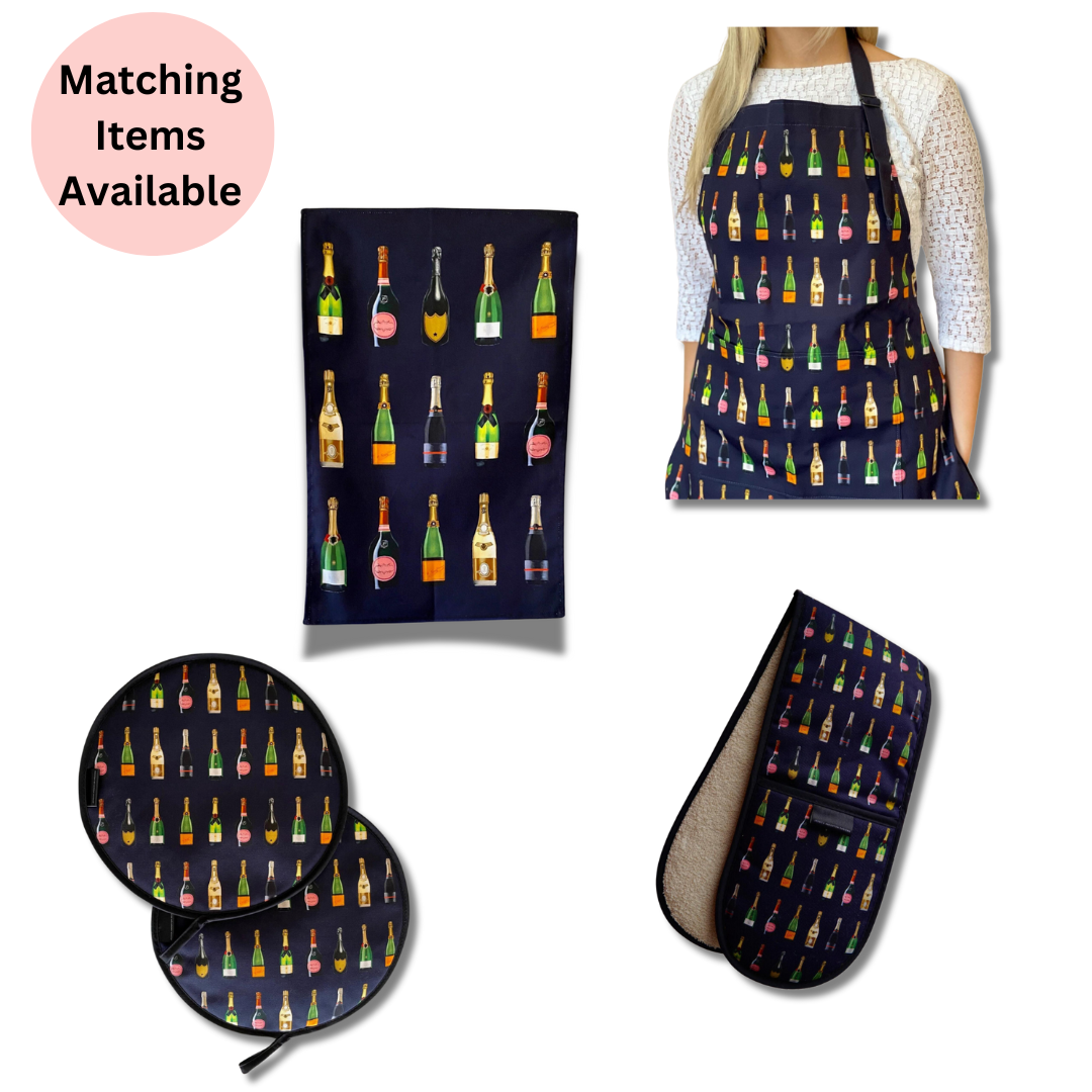 Navy Champagne Double Oven Glove, Navy Champagne Tea Towel, Navy Champagne Chef's Pads For AGA and Navy Champagne Apron being worn by woman all on white background with pink disc with text which reads "matching items available".  