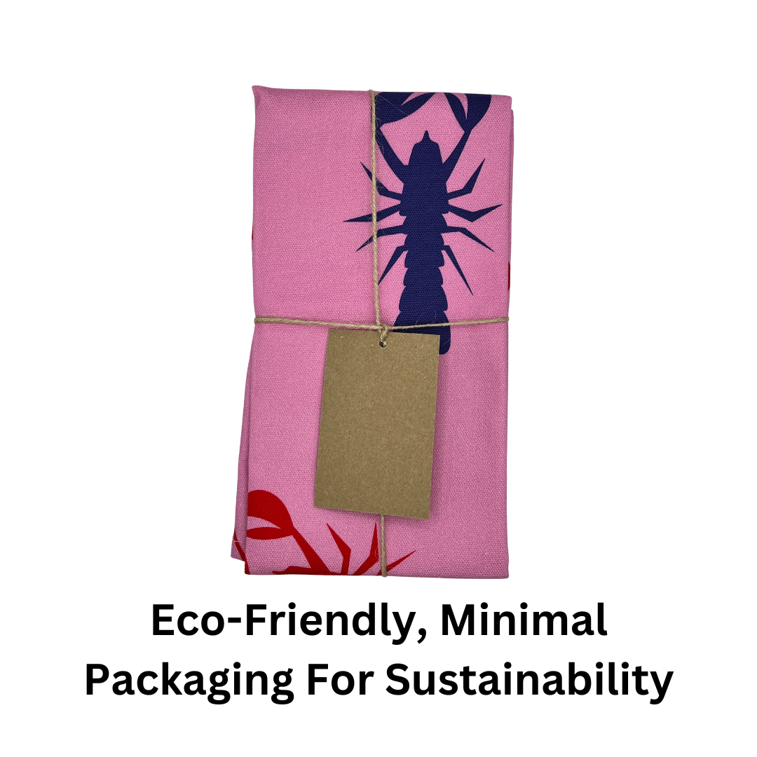 100% Cotton Pink Lobster Tea Towel folded and tied with jute twine and brown paper label with text which reads "eco-friendly, minimal packaging for sustainability".