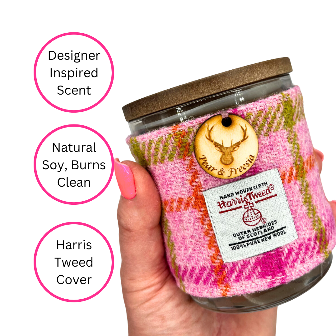 Pear & Freesia Harris Tweed Handmade Soy Candle held in woman's hand on white background with three pink circles highlighting the benefits - designer inspired scent, natural soy, burns clean, Harris Tweed Cover