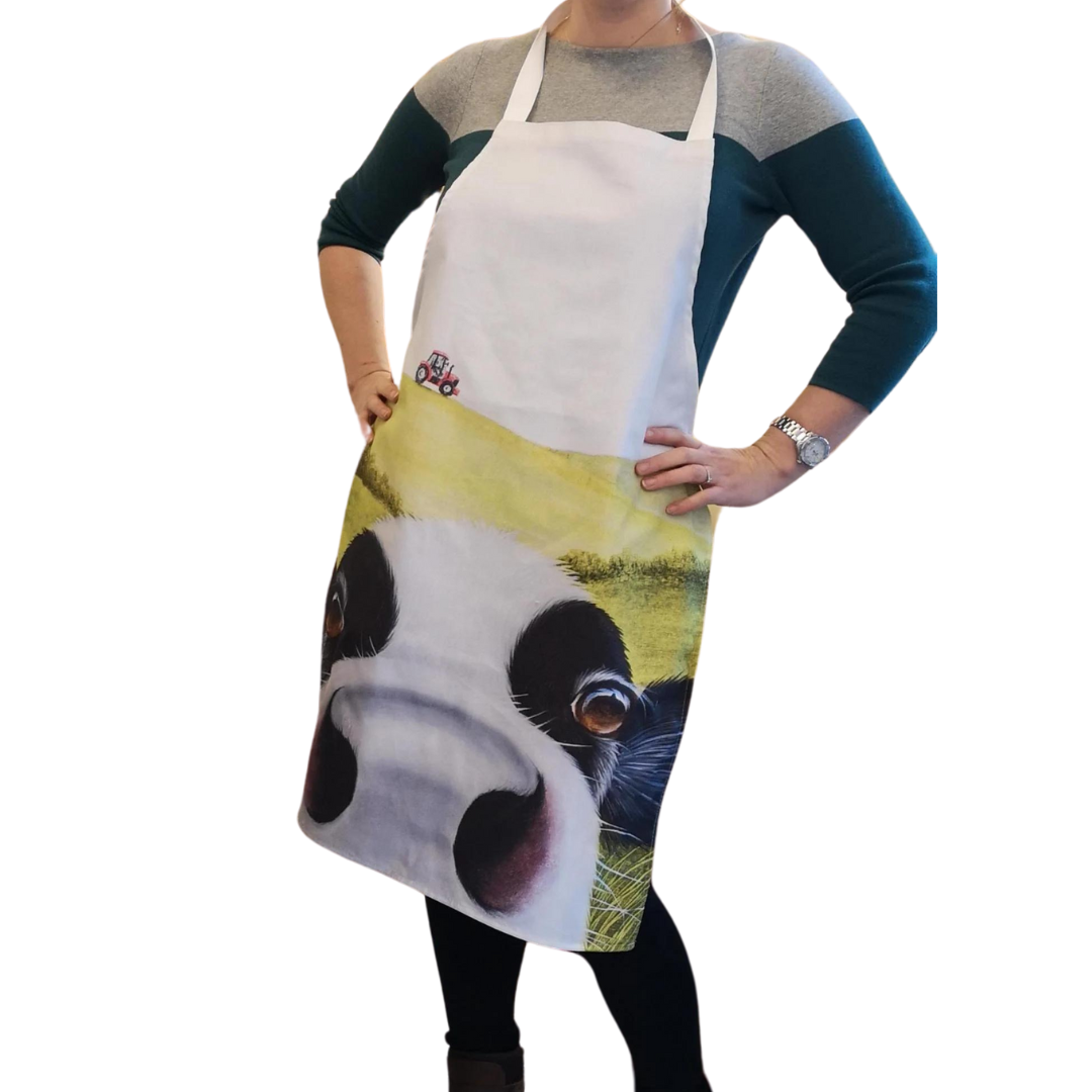 Cow In Pasture Friesian Cow Apron being worn by a woman on white background.