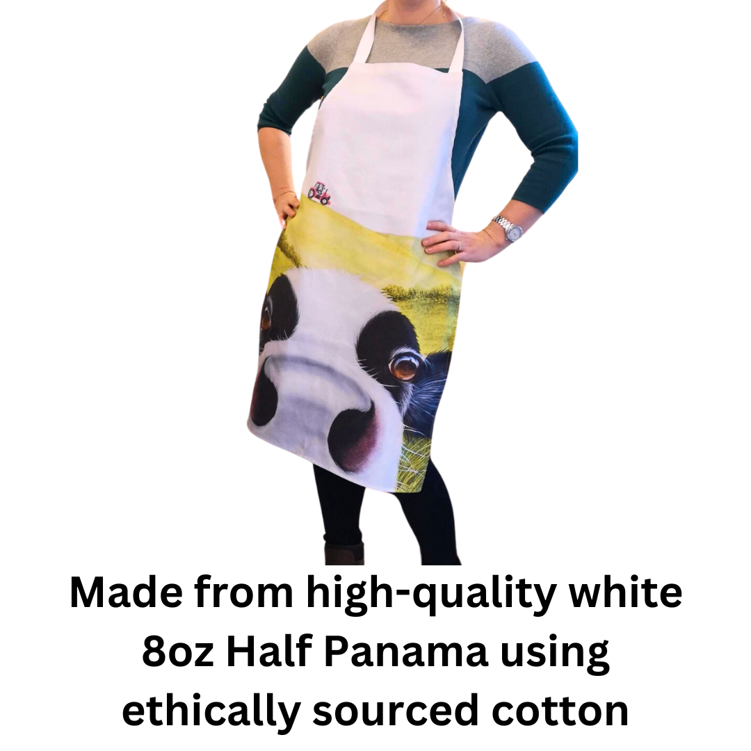 Cow In Pasture Friesian Cow Apron being worn by woman on white background with text which reads "made from high-quality white 8oz half panama using ethically sourced cotton".