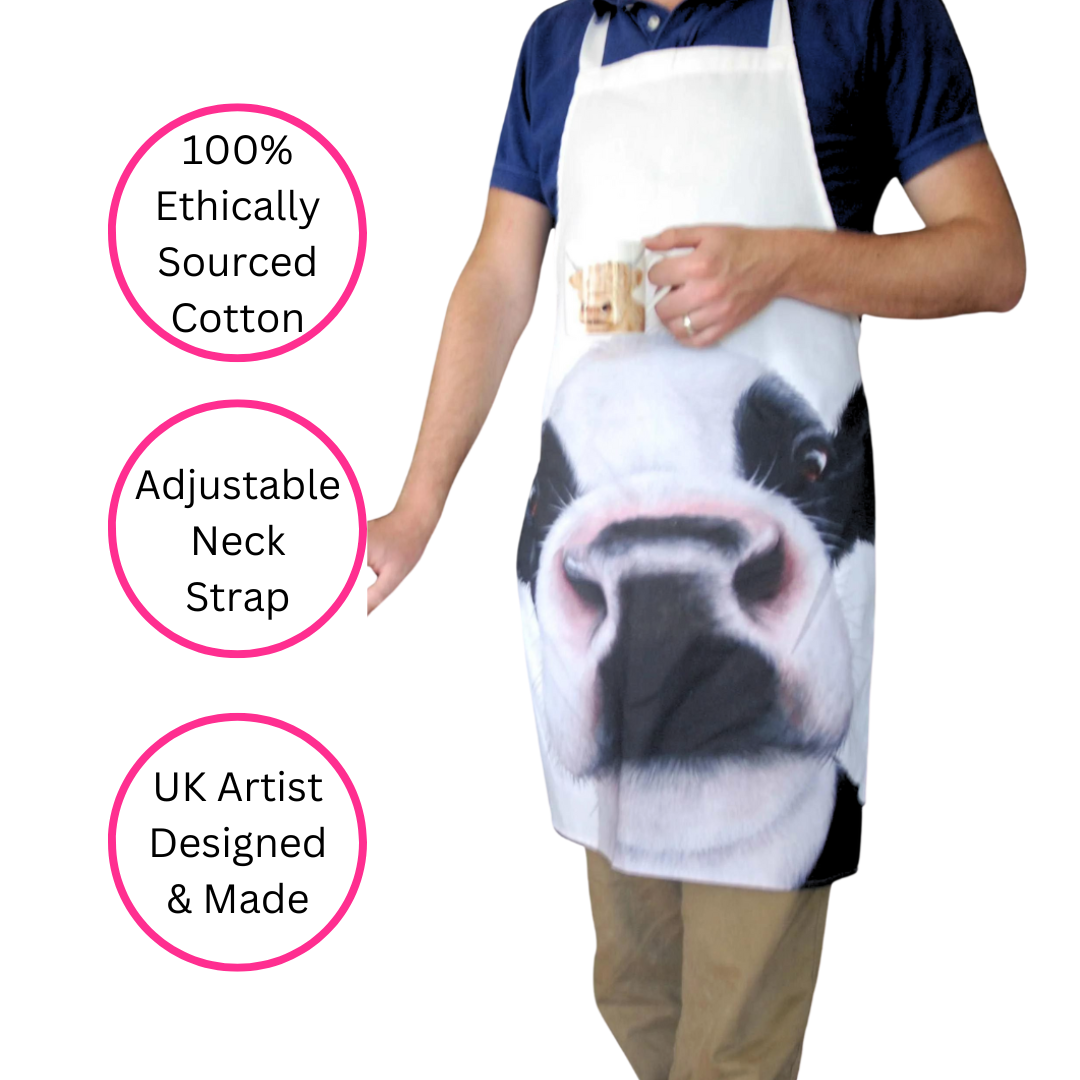 Friesian Black & White Cow Apron being worn by man on white background with three discs highlighting the features, 100% ethically sourced cotton, adjustable neck strap and UK artis designed & made.