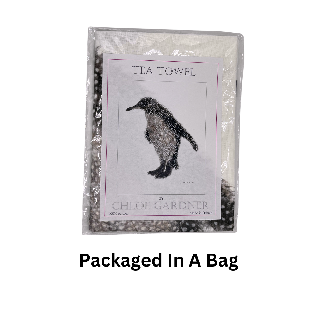 Grey Feather Penguin Tea Towel folded and packed in plastic bag on white background with the text "Packaged in a bag".