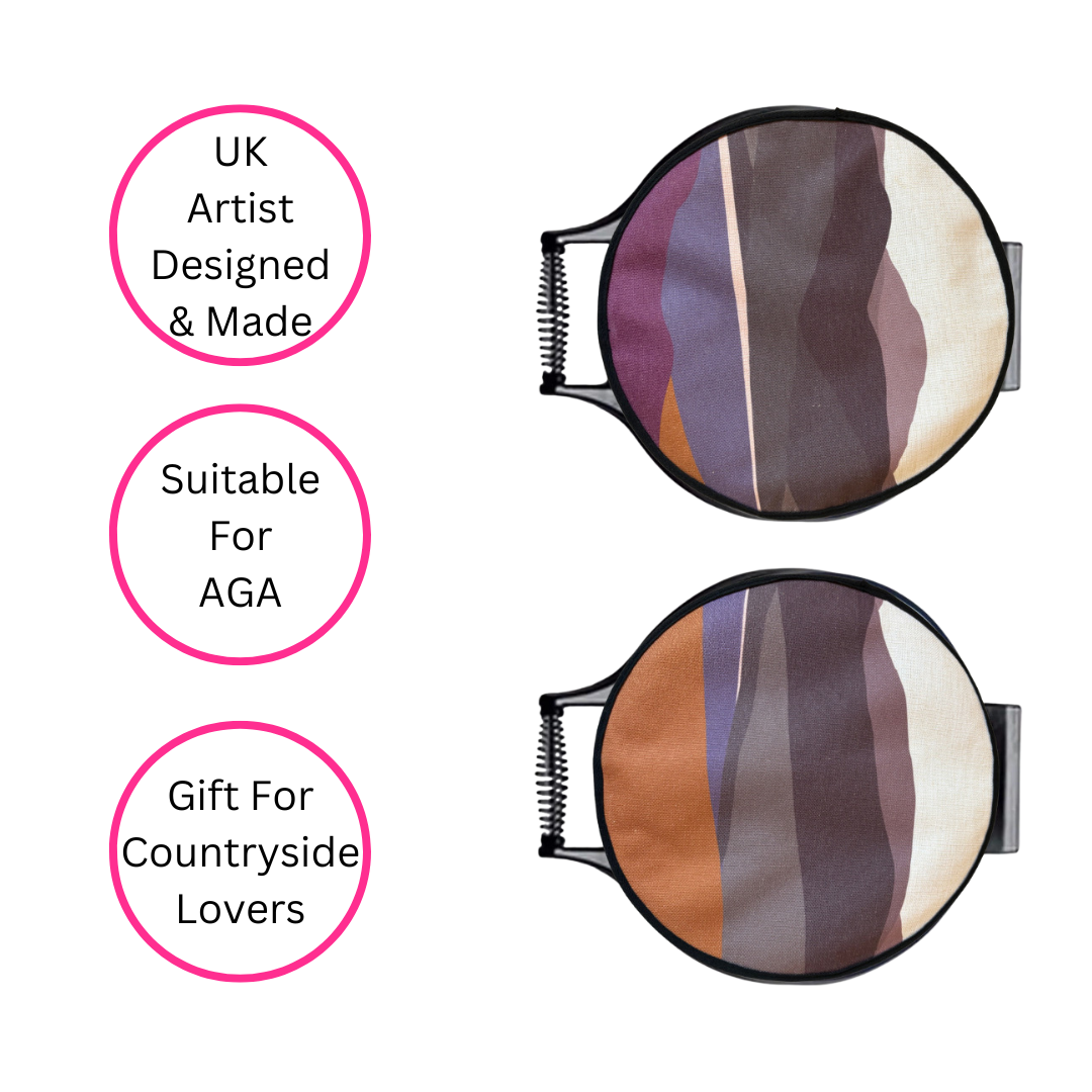 Purple Hills Chef's Pads For AGA on AGA lids on white background with three pink discs which highlight the benefits - UK artist designed & made, suitable for AGA and gift for countryside lovers.  