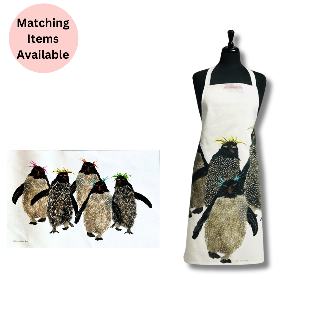 Rockhopper Penguin Tea Towel and Rockhopper Apron on white background with pink disc with text which reads "matching items available".