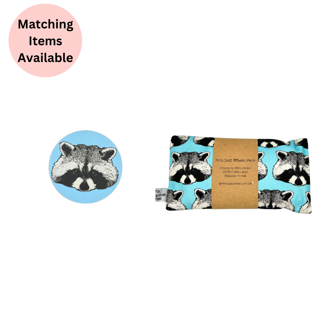 Melamine Blue Racoon Coaster (Round)  and Racoon Microwaveable Wheat Bag on white background with pink disc with text which states "matching items available".