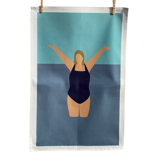 100% Cotton Wild Swimmer Tea Towel with pegs on white background