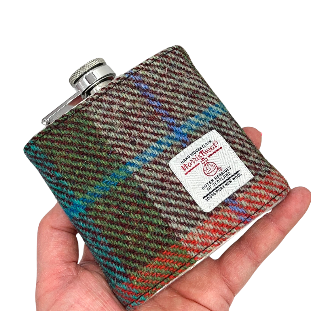 Orange & Green Harris Tweed Hip Flask being held in woman's hand