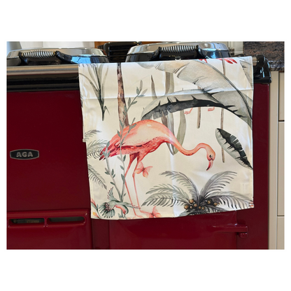 White Tropical Flamingo Tea Towel On Claret Red AGA Close Up View.  Quirky Gift For Home Lovers.  