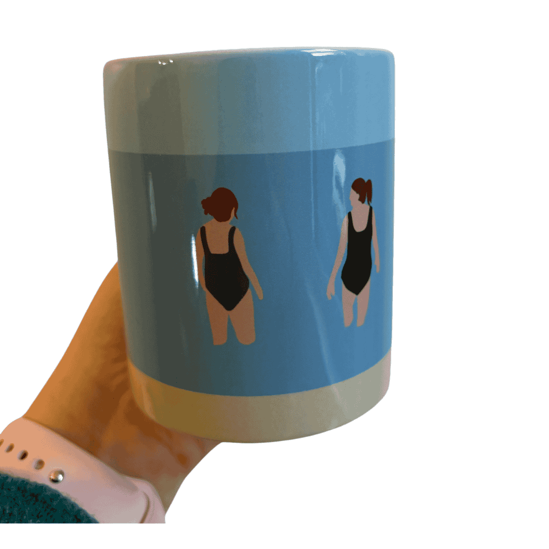 Wild Friends Wild Swimming Mug being held in woman's hand.