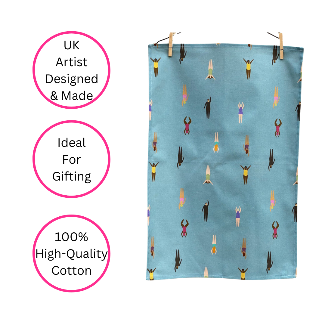 Wild Swimming Tea Towel hanging by pegs on white background with three pink discs highlighting the benefits - UK artist designed & made, Ideal for gifting and 100% high-quality cotton. 