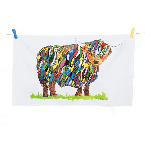 Bright Highland Cow Tea Towel On White pegged on washing line and on white background.